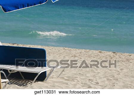 Lounge chair on the beach View Large Photo Image Stock Image - Lounge chair on the beach. Fotosearch