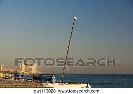 Stock Photo - Sailboat on the beach. Fotosearch