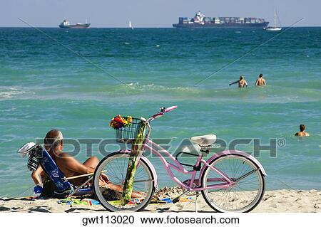 Tourist on the beach View Large Photo Image Stock Image - Tourist on the beach. Fotosearch