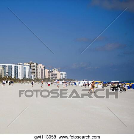 Tourists on the beach View Large Photo Image Stock Photo - Tourists on the beach. Fotosearch