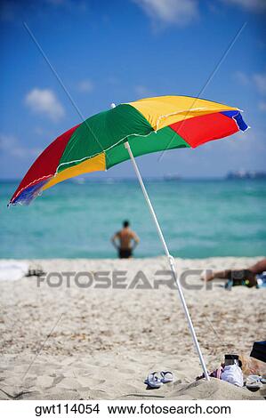 Beach umbrella on the beach View Large Photo Image Picture - Beach umbrella on the beach. Fotosearch