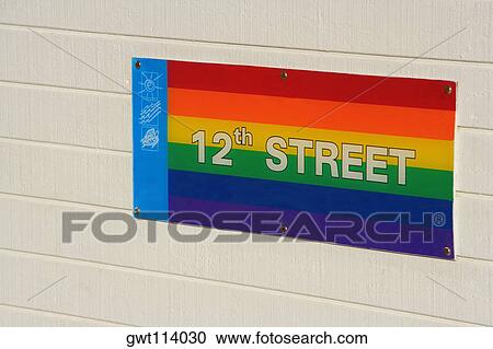 Close-up of a street name sign on the wall View Large Photo Image Stock Image - Close-up of a street name sign on the wall. Fotosearch