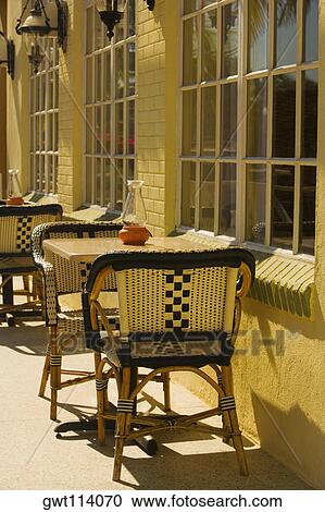 Empty chairs at a sidewalk cafe View Large Photo Image Stock Image - Empty chairs at a sidewalk cafe. Fotosearch