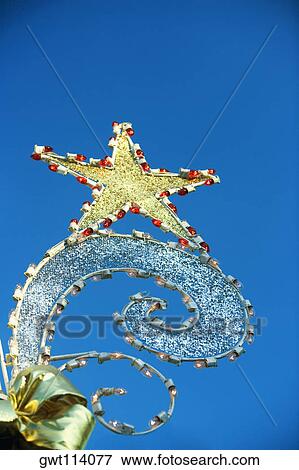 Low angle view of a star shaped light View Large Photo Image Stock Photo - Low angle view of a star shaped light. Fotosearch