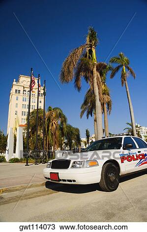Stock Image - Police car parked in front of a building, Miami, Florida, USA. Fotosearch