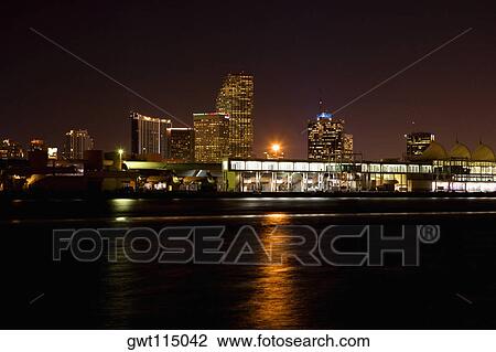Buildings at the waterfront lit up at night, Miami, Florida, USA View Large Photo Image Stock Image - Buildings at the waterfront lit up at night, Miami, Florida, USA. Fotosearch