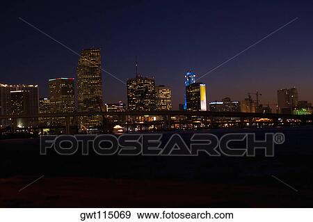 Buildings in a city lit up at night, Miami, Florida, USA View Large Photo Image Stock Photo - Buildings in a city lit up at night, Miami, Florida, USA. Fotosearch
