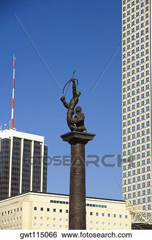 Low angle view of a statue in front of buildings in a city, Miami, Florida, USA View Large Photo Image Stock Photograph - Low angle view of a statue in front of buildings in a city, Miami, Florida, USA. Fotosearch
