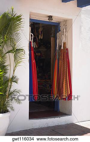 Bags hanging in the doorway of a store, Cartagena, Colombia View Large Photo Image Picture - Bags hanging in the doorway of a store, Cartagena, Colombia. Fotosearch