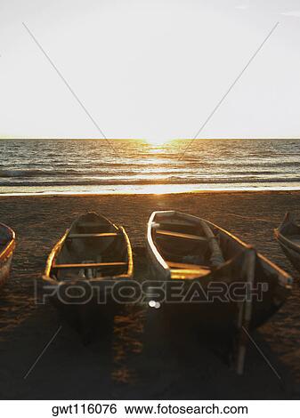 Stock Photograph - Boats on the beach, Cartagena, Colombia. Fotosearch