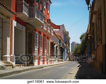 Buildings on both sides of a road, Cartagena, Colombia View Large Photo Image Stock Image - Buildings on both sides of a road, Cartagena, Colombia. Fotosearch