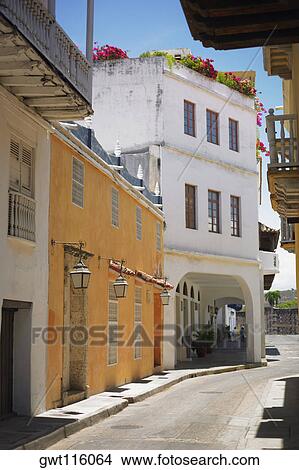 Buildings on both sides of an alley, Cartagena, Colombia View Large Photo Image Picture - Buildings on both sides of an alley, Cartagena, Colombia. Fotosearch