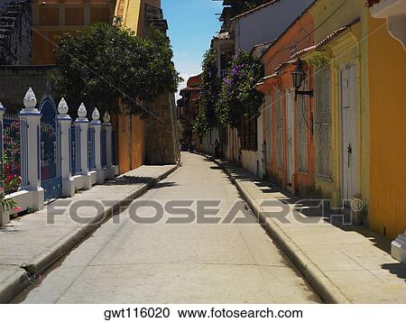 Buildings on both sides of an alley, Cartagena, Colombia View Large Photo Image Stock Image - Buildings on both sides of an alley, Cartagena, Colombia. Fotosearch