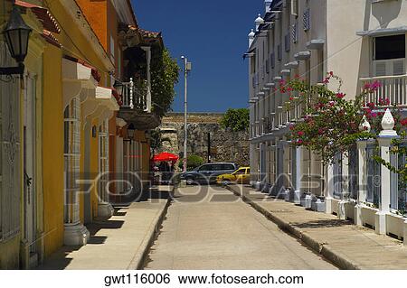 Buildings on both sides of an alley, Cartagena, Colombia View Large Photo Image Stock Photograph - Buildings on both sides of an alley, Cartagena, Colombia. Fotosearch