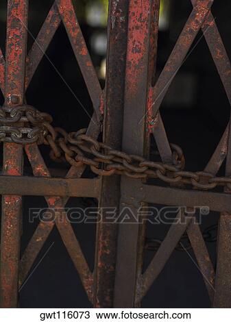 Close-up of a chain on a gate View Large Photo Image Stock Image - Close-up of a chain on a gate. Fotosearch