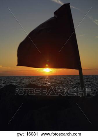 Close-up of a flag fluttering on a rock, Cartagena, Colombia View Large Photo Image Stock Image - Close-up of a flag fluttering on a rock, Cartagena, Colombia. Fotosearch