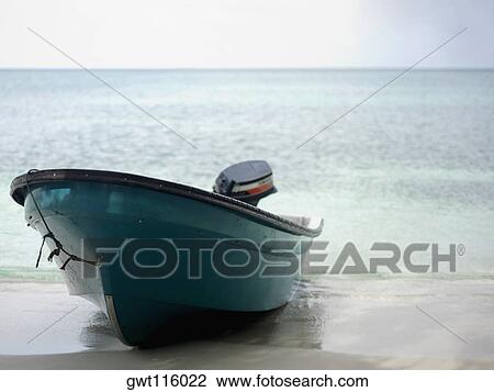 Stock Image - Close-up of a motorboat on the beach. Fotosearch