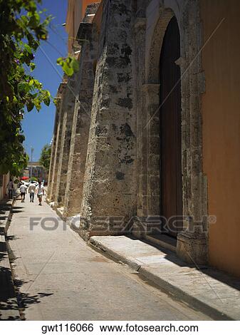 Four men walking in an alley, Cartagena, Colombia View Large Photo Image Stock Photograph - Four men walking in an alley, Cartagena, Colombia. Fotosearch