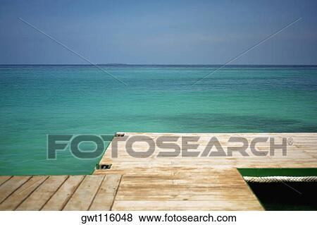 Pier in the sea View Large Photo Image Stock Photo - Pier in the sea. Fotosearch