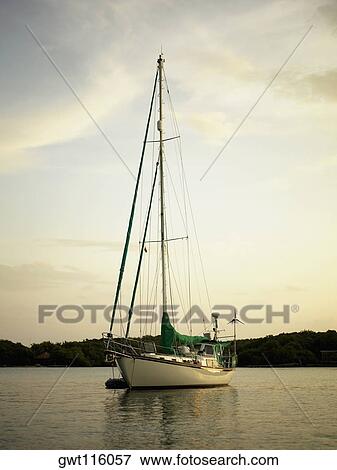 Sailboat in the sea View Large Photo Image Stock Photo - Sailboat in the sea. Fotosearch