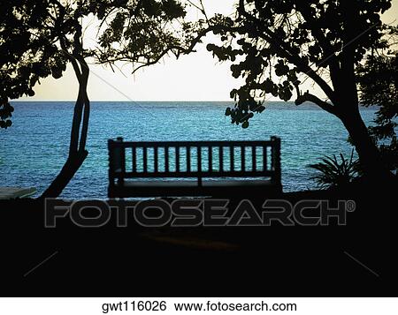 Silhouette of a bench near the sea View Large Photo Image Stock Photograph - Silhouette of a bench near the sea. Fotosearch