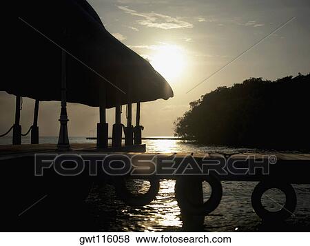 Silhouette of a gazebo in the sea View Large Photo Image Stock Photo - Silhouette of a gazebo in the sea. Fotosearch