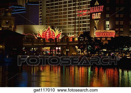 Buildings on waterfront lit up at night, Las Vegas, Nevada, USA View Large Photo Image Stock Image - Buildings on waterfront lit up at night, Las Vegas, Nevada, USA. Fotosearch