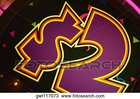 Stock Image - Close-up of a dollar sign on a slot machine in a casino, Las Vegas, Nevada, USA. Fotosearch