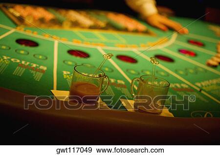 Stock Photo - Close-up of a person's hand on a gaming table, Las Vegas, Nevada, USA. Fotosearch