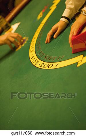 High angle view of person's hand on a gaming table, Las Vegas, Nevada, USA View Large Photo Image Stock Image - High angle view of person's hand on a gaming table, Las Vegas, Nevada, USA. Fotosearch