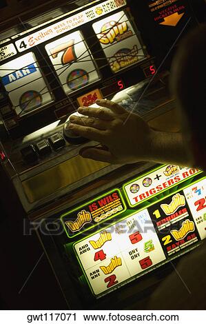 Person's hand in front of a slot machine, Las Vegas, Nevada, USA View Large Photo Image Stock Image - Person's hand in front of a slot machine, Las Vegas, Nevada, USA. Fotosearch