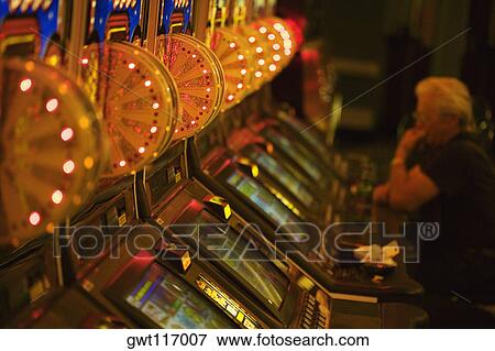 Side profile of a person sitting in a casino, Las Vegas, Nevada, USA View Large Photo Image Stock Photo - Side profile of a person sitting in a casino, Las Vegas, Nevada, USA. Fotosearch