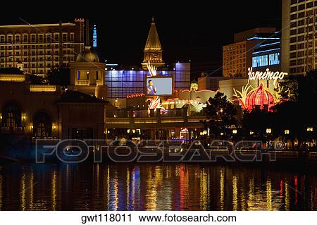 Buildings at the waterfront lit up at night, Las Vegas, Nevada, USA View Large Photo Image Stock Image - Buildings at the waterfront lit up at night, Las Vegas, Nevada, USA. Fotosearch