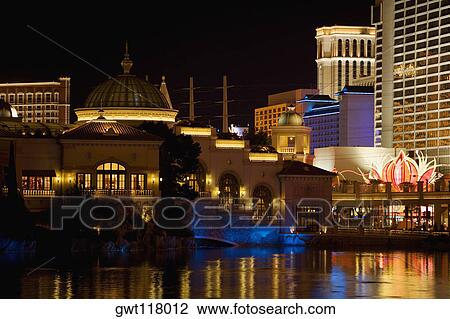 Buildings at the waterfront lit up at night, Las Vegas, Nevada, USA View Large Photo Image Stock Image - Buildings at the waterfront lit up at night, Las Vegas, Nevada, USA. Fotosearch