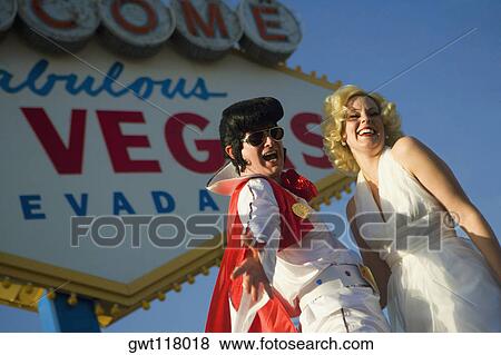 Mid adult man and a mid adult woman dressed in costumes, Las Vegas, Nevada, USA View Large Photo Image Stock Photo - Mid adult man and a mid adult woman dressed in costumes, Las Vegas, Nevada, USA. Fotosearch