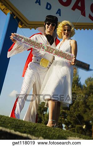 Mid adult man and a mid adult woman dressed in costumes, Las Vegas, Nevada, USA View Large Photo Image Stock Photo - Mid adult man and a mid adult woman dressed in costumes, Las Vegas, Nevada, USA. Fotosearch