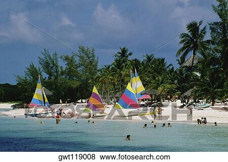 Colorful sails on a beach, Treasure Island, Abaco, Bahamas View Large Photo Image Stock Photo - Colorful sails on a beach, Treasure Island, Abaco, Bahamas. Fotosearch