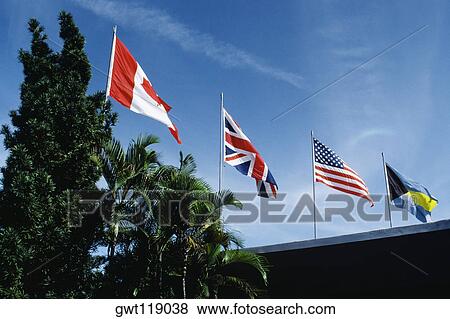 Stock Photo - Flags fluttering due to wind on a sunny day, Freeport, Bahamas. Fotosearch