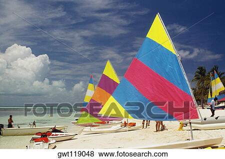 Stock Photo - Sailboats on a sunny beach, Treasure Island, Abaco, Bahamas. Fotosearch