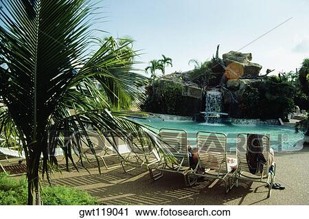 Side view of a swimming pool at Princess Hotel, Freeport, Bahamas View Large Photo Image Stock Image - Side view of a swimming pool at Princess Hotel, Freeport, Bahamas. Fotosearch