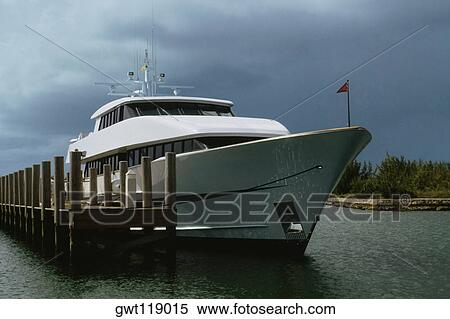 Side view of an anchored yacht, Grand Bahamas, Bahamas View Large Photo Image Stock Photography - Side view of an anchored yacht, Grand Bahamas, Bahamas. Fotosearch