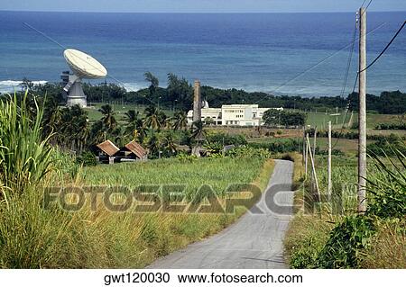 A road passing through lush meadows with a satellite dish at a side, Barbados, Caribbean View Large Photo Image Stock Image - A road passing through lush meadows with a satellite dish at a side, Barbados, Caribbean. Fotosearch