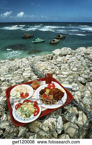 Food being served on plates kept on a dyke, Barbados View Large Photo Image Stock Photo - Food being served on plates kept on a dyke, Barbados. Fotosearch