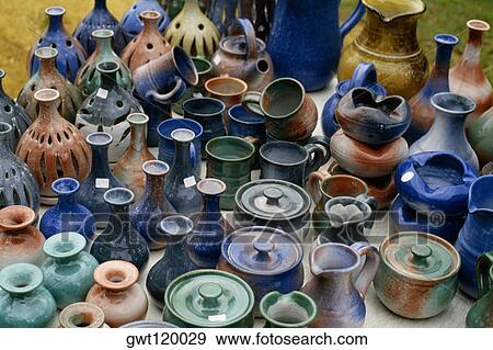 Stock Photo - Pottery displayed at a roadside stand, Barbados. Fotosearch