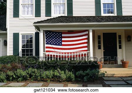 Picture - An American flag is displayed on a porch, Bermuda. Fotosearch
