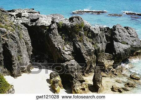 High angle view of a couple amid the rocks, Atwood bay beach, Bermuda View Large Photo Image Stock Photo - High angle view of a couple amid the rocks, Atwood bay beach, Bermuda. Fotosearch