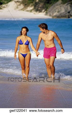 Front view of a couple in swimsuits, Horse-shoe Bay beach, Bermuda View Large Photo Image Stock Image - Front view of a couple in swimsuits, Horse-shoe Bay beach, Bermuda. Fotosearch