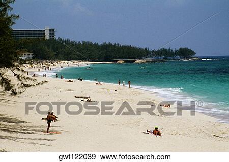 Stock Photo - Large group of people sunbathing along the seacoast, Paradise Island, Bahamas. Fotosearch