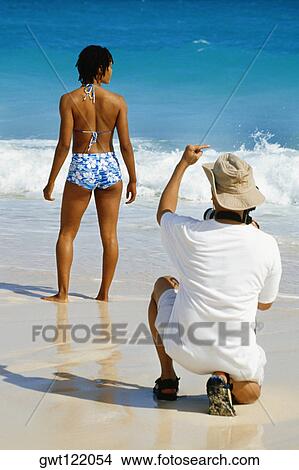 Photographer shooting a model, Horse-shoe Bay Beach, Bermuda View Large Photo Image Picture - Photographer shooting a model, Horse-shoe Bay Beach, Bermuda. Fotosearch