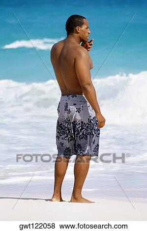 Rear view of man in trunks, Horse-shoe Bay beach, Bermuda View Large Photo Image Stock Photo - Rear view of man in trunks, Horse-shoe Bay beach, Bermuda. Fotosearch
